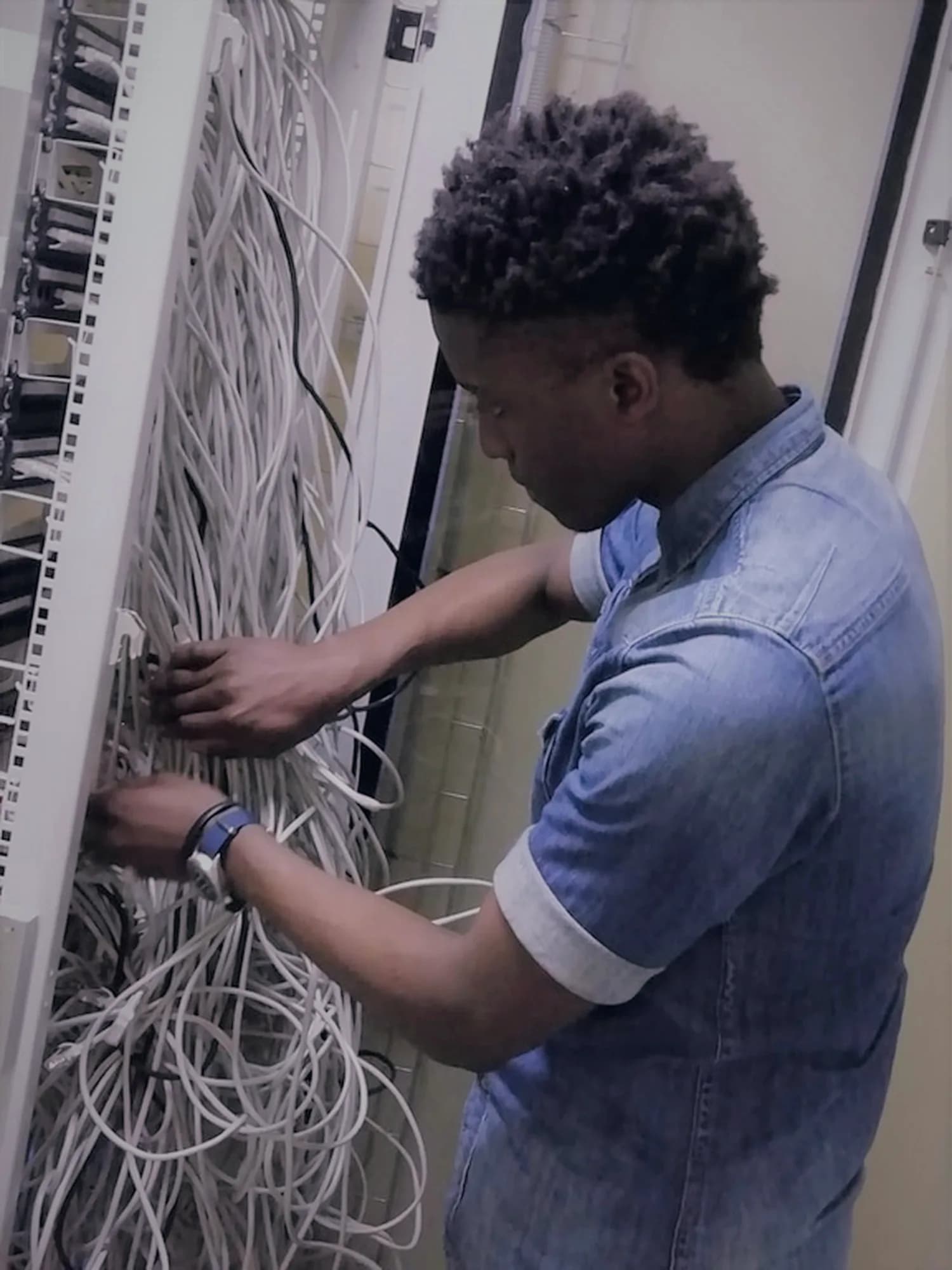 Engineer organizing structured cabling